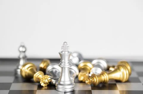 The silver king chess surrounded by chess pieces , business strategy Stock Photos