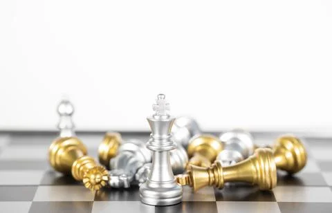 The silver king chess surrounded by chess pieces , business strategy Stock Photos