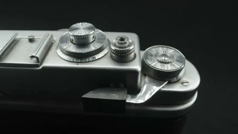 The silver knobs on the top of the old vintage camera 스톡 동영상 147250702