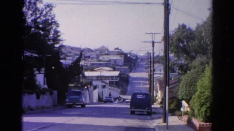SILVER LAKE CALIFORNIA-1966: Street View Of Old Cars On Either Side Of The Stock Footage 124059894