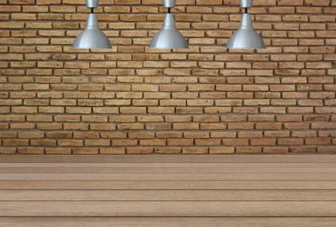 Silver lamps on the ceiling and a backdrop on a brick wall with brown wood .. Stock Photos