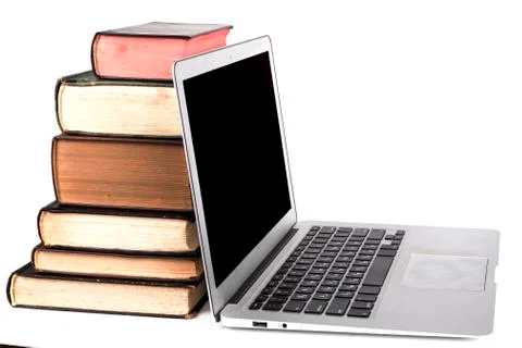 Silver Laptop and Books Stock Photos