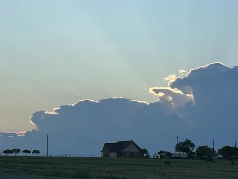 Silver Lining Thunderstorm Cloud Over Rural Texas Farmhouse Stock Photos