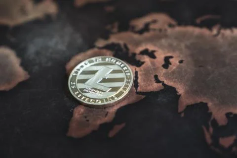Silver Litecoin Token on World Map in Asia Stock-Fotos
