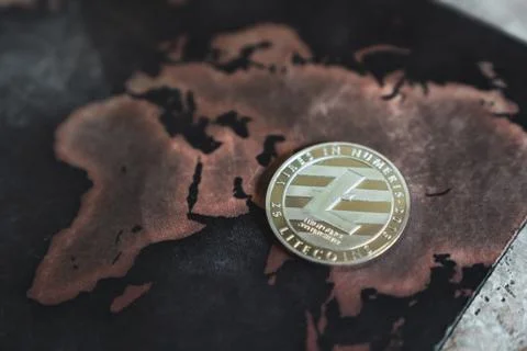 Silver Litecoin Token on World Map in Asia Stock Photos