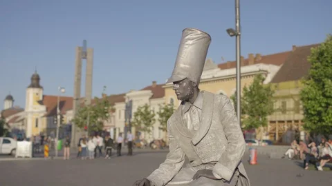 Silver living statue in a square Stock Footage 100367067
