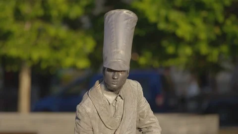 Silver living statue with tall hat Stock Footage 100367286