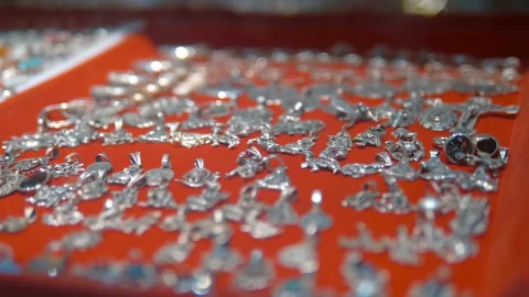 Silver lockets to the chains in traditional Indian style are sold as souvenirs  Video stock 108126559