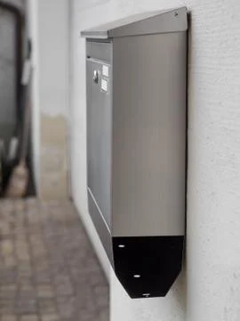 A silver mailbox on the wall Foto stock