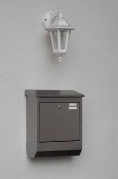 A silver mailbox on the wall Stock Photos