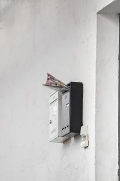 A silver mailbox on the wall Foto stock