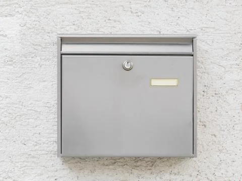 A silver mailbox on the wall Stock Photos