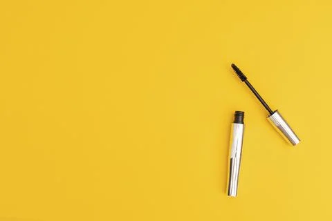 Silver mascara with yellow background Stock Photos