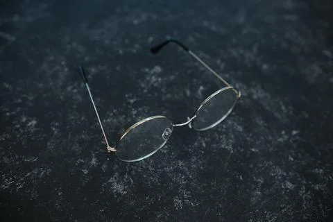Silver metal glasses. On a solid black stone background. With a soft blurred  Stock Photos