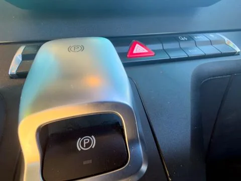 Silver metallic auto handbrake switch portrait 库存照片