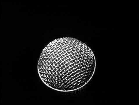 Silver microphone on a black background. Stock-Fotos