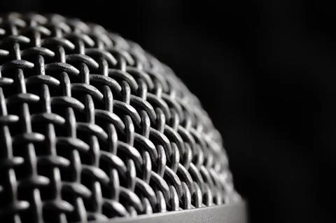 Silver microphone on a black background. Stock Photos