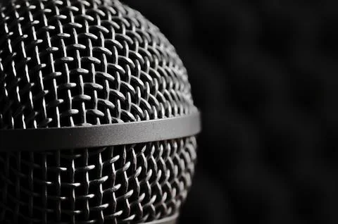 Silver microphone on a black background. Stock Photos
