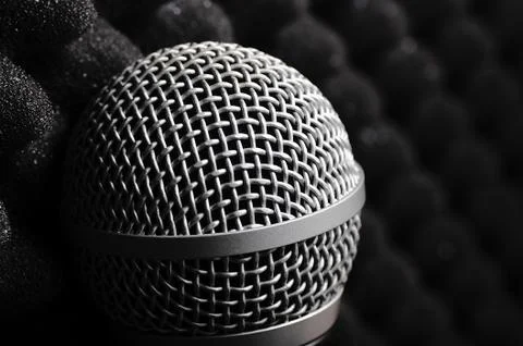 Silver microphone on a black background. Stockfoto's