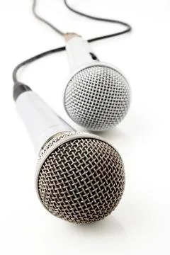 Silver microphone with black wire Stock Photos