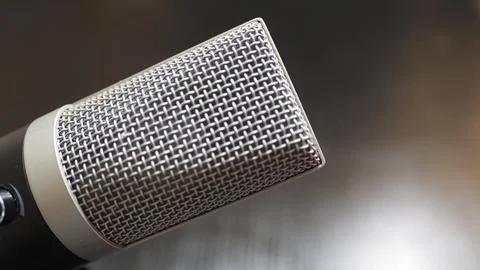 Silver microphone solid blurry background 库存照片