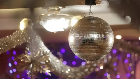 Silver Mirror Disco ball with bright rays. Rotating disco mirror ball. Stock Footage 227206017