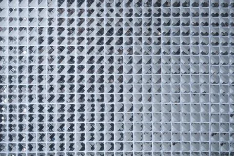 Silver Mosaic pattern of tiles.Wall is decorated with stained glass small p.. Foto stock