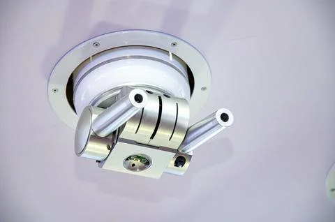 A silver multi-angle fire sprinkler with two small holes on the top. The ob.. Stock Photos