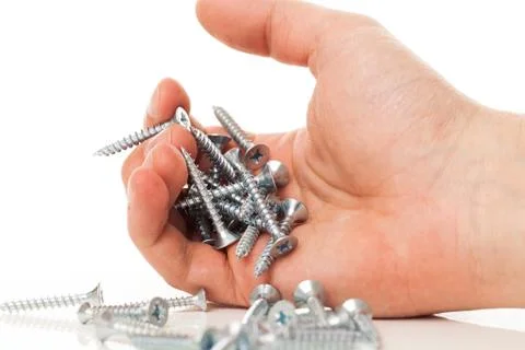 Silver nails in human hand Stock Photos