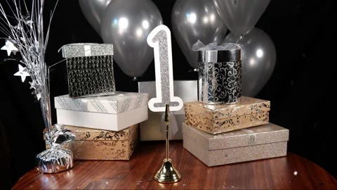 Silver Number 1 with Silver Glitter Confetti Sparkles with Gifts and Balloons Stock Footage 346644956
