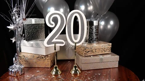 Silver Number 20 with Silver Confetti Glitter Sparkles with Gifts and Balloons Stock Footage 346644910