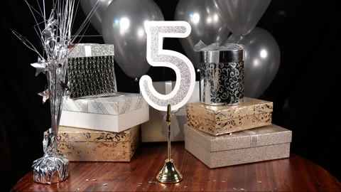 Silver Number 5 with Silver Glitter Confetti Sparkles with Gifts and Balloons Stock Footage 346644806