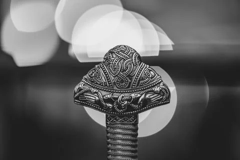 A silver object with a design on it Stock Photos