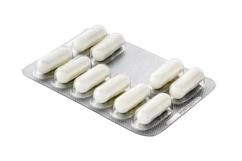 Silver packaging of white color tablets isolated on white background Stock Photos