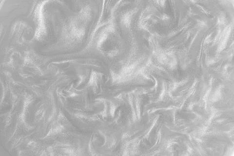 Silver paint background. Motion of the shiny liquid.  Stock Photos