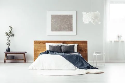 Silver painting in spacious bedroom Stock Photos