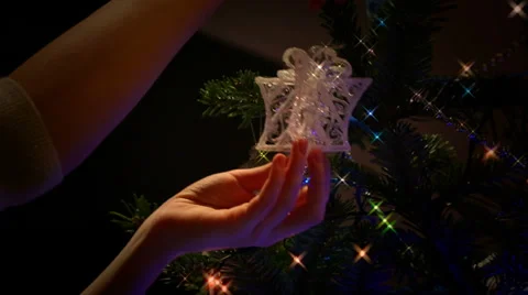 Silver parcel decoration being hung on a Christmas tree. Sparkle and grade 스톡 동영상 33740329