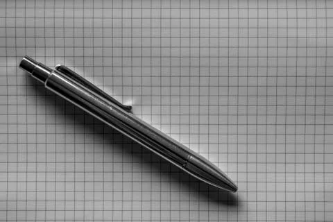 Silver Pen on Grid Paper (Graph) Stock Photos