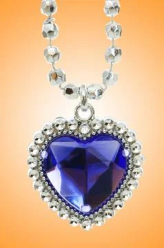 Silver pendant against gradient background Stock Photos
