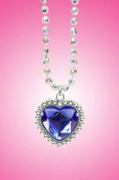 Silver pendant against gradient background Stock Photos