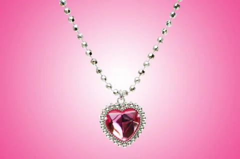Silver pendant against gradient background Stock Photos