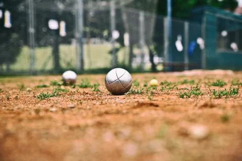 Silver petanque balls on the ground. Stock Photos