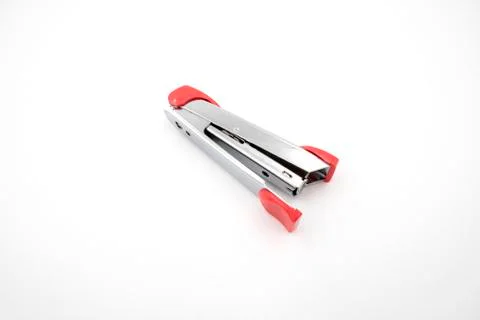 Silver pink stapler isolated on white background Stock Photos