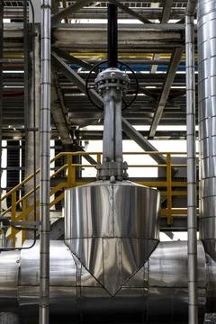 Silver pipe with a yellow railing Stock Photos