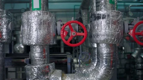 Silver pipes with a red valve close-up. Removing the camera from the pipes Stock Footage 148875281