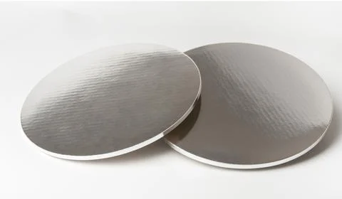 Silver plastic round tray isolated over white background Stock Photos