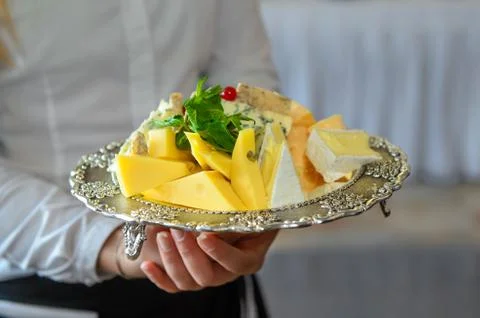 Silver plate with cheese Stock Photos