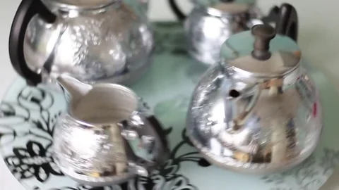 Silver pots on the rotating tray Stock Footage 71983315