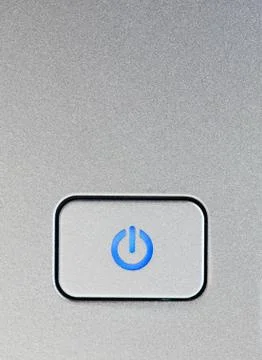 Silver power button close-up Stock Photos