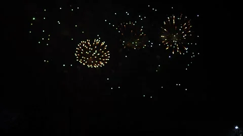 Silver red pink sparks scattering fireworks on the black night sky. General.. 库存影片 296245155